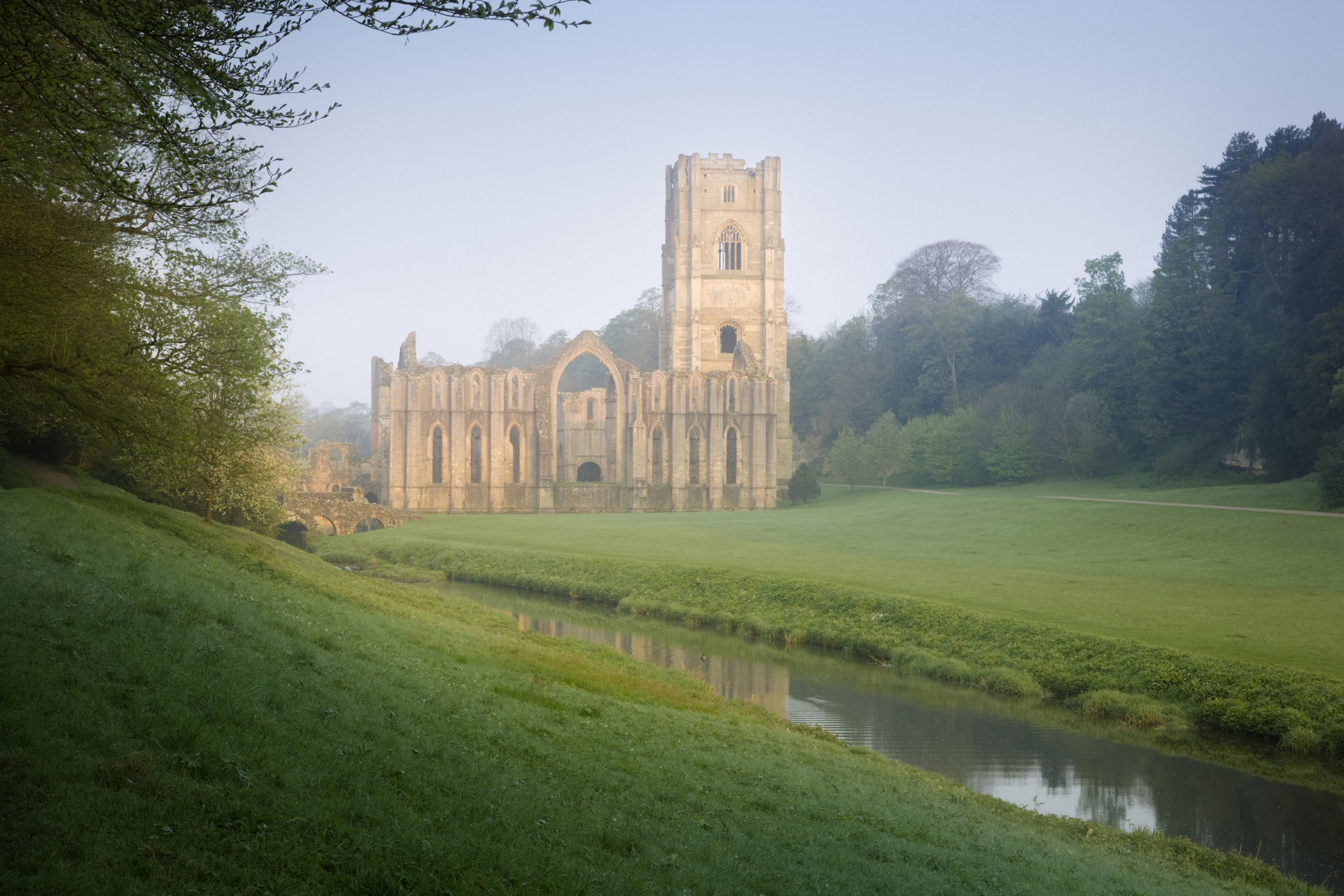 A view along the River Skell towards Fountains Abbey, North Yorkshire, largest monastic ruin in the UK.